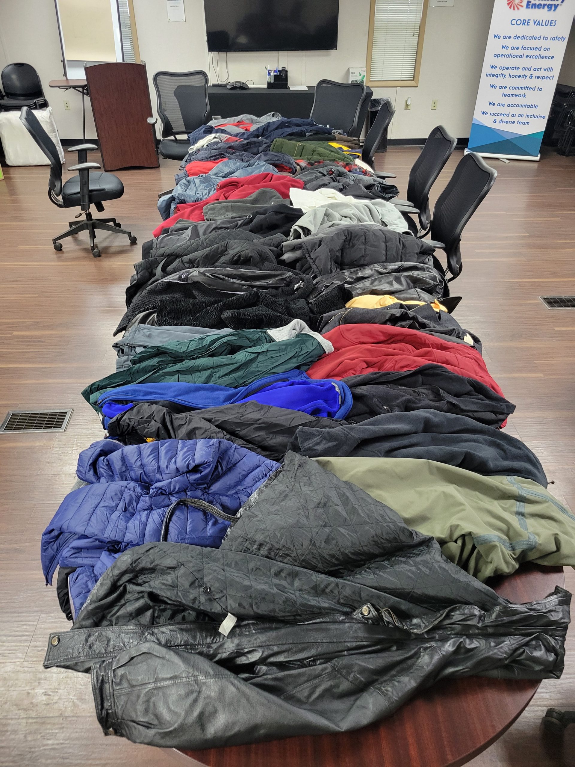 Photo of the coats and other gear collected for donation.